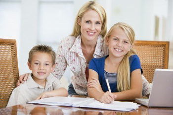 mom helping daughter and son with homework