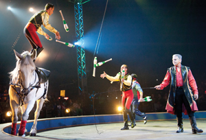 The Donnert Brothers juggle a variety of objects while standing atop galloping horses. Donnert Brothers, Ringling Bros. and Barnum and Bailey Circus, Fully Charged