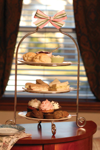 Photo courtesy of The Royal Tea Cup high tea tray with sweets and scones