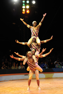 The Kenyan Brothers "pile" on the entertainment at "Dance On!" Photo by Bertrand Guay/Big Apple Circus The Kenyan Brothers