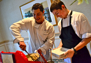 Café of Love executive chef Michael Cutney tends to his spring onion risotto with Lucas Diehl ready to plate. Photo courtesy of Diana Costello/Co-Communications. Top Chefs of Northern Westchester