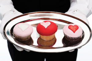 Handing your love on a silver platter to your spouse—the classic easy compromise of “whatever you want is okay with me”—is a recipe for resentment, not a happy partnership. three cupcakes with heart shaped icing on a silver platter