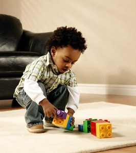 little boy playing with blocks