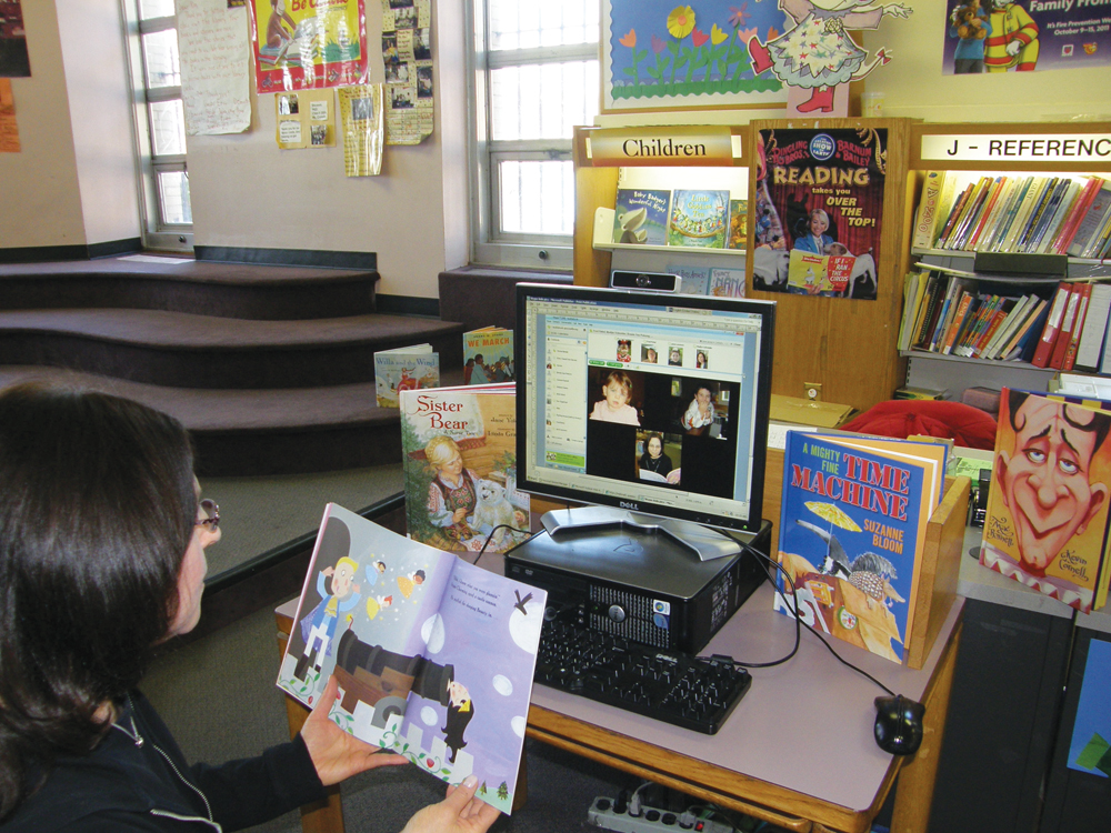 Schneider reads to homebound children via Skype. Photo by Kim Dono skype story time at Queens Library