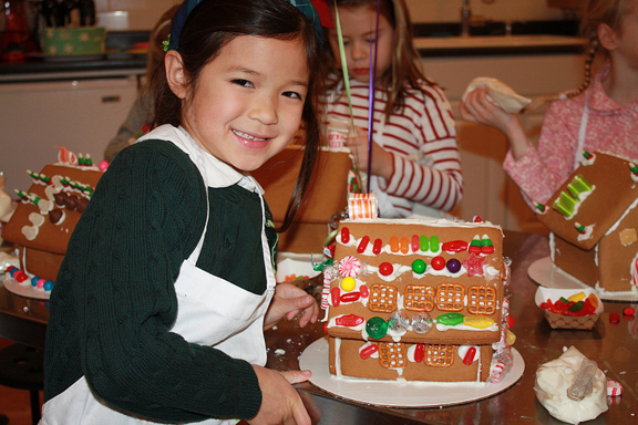Courtesy Taste Buds Kitchen girl decorating gingerbreadhouse at Taste Buds Kitchen