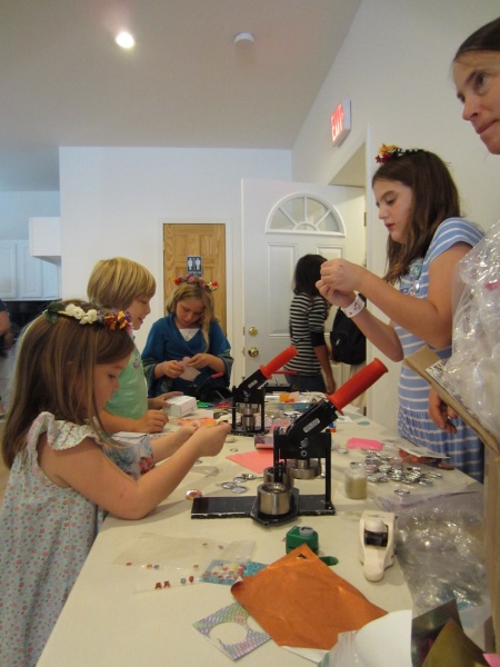Kids were able to sample the crafts offered at Bird River Studios during its open house. kids at a craft table