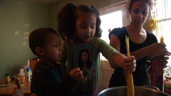 Courtesy Magnolia Pictures Barbie and children make dinner