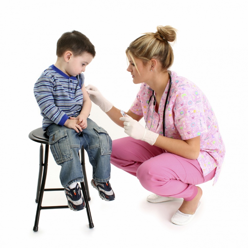nurse giving child a shot child and nurse