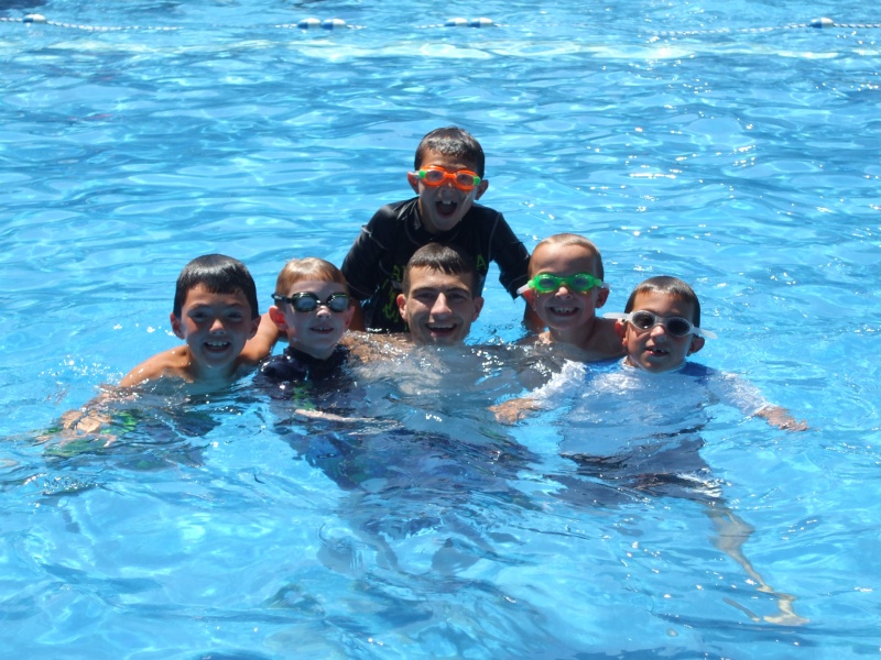 Courtesy Harbor Counrty Day School Summer Camp campers and counselor swimming