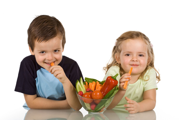 Key Nutrients for Active Children young boy and girl eating vegetables