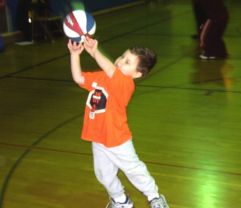 Courtesy First Shot Basketball School young boy shooting basketball