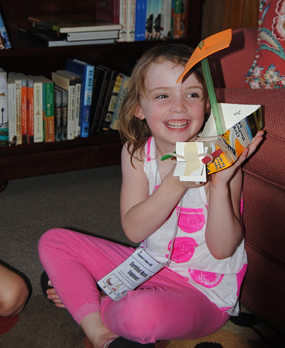 Courtesy Curious-on-Hudson girl with recycled boat craft