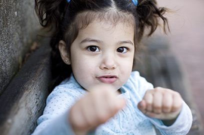 toddler girl making a face