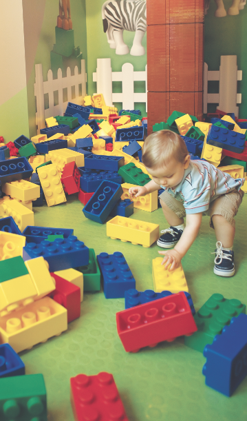 kid_playing_with_legos lego play kid