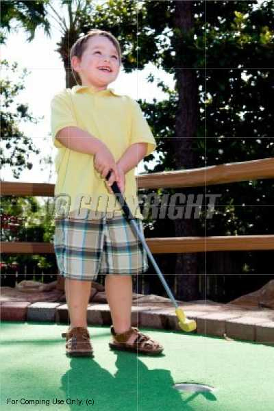 boy playing golf